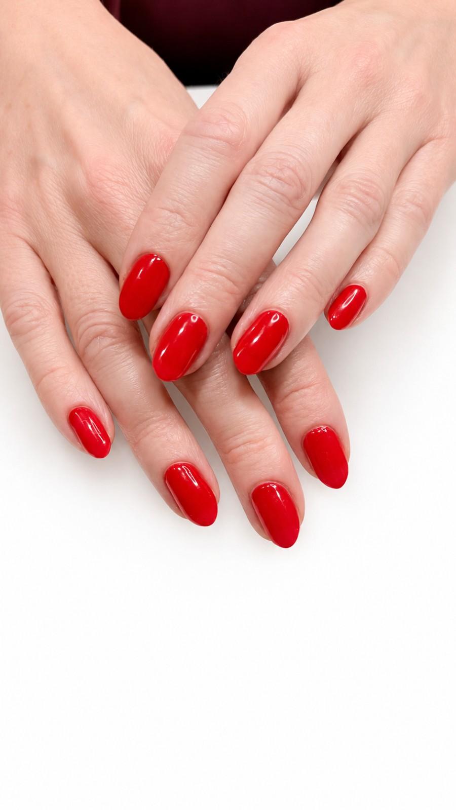 Red manicure on hands